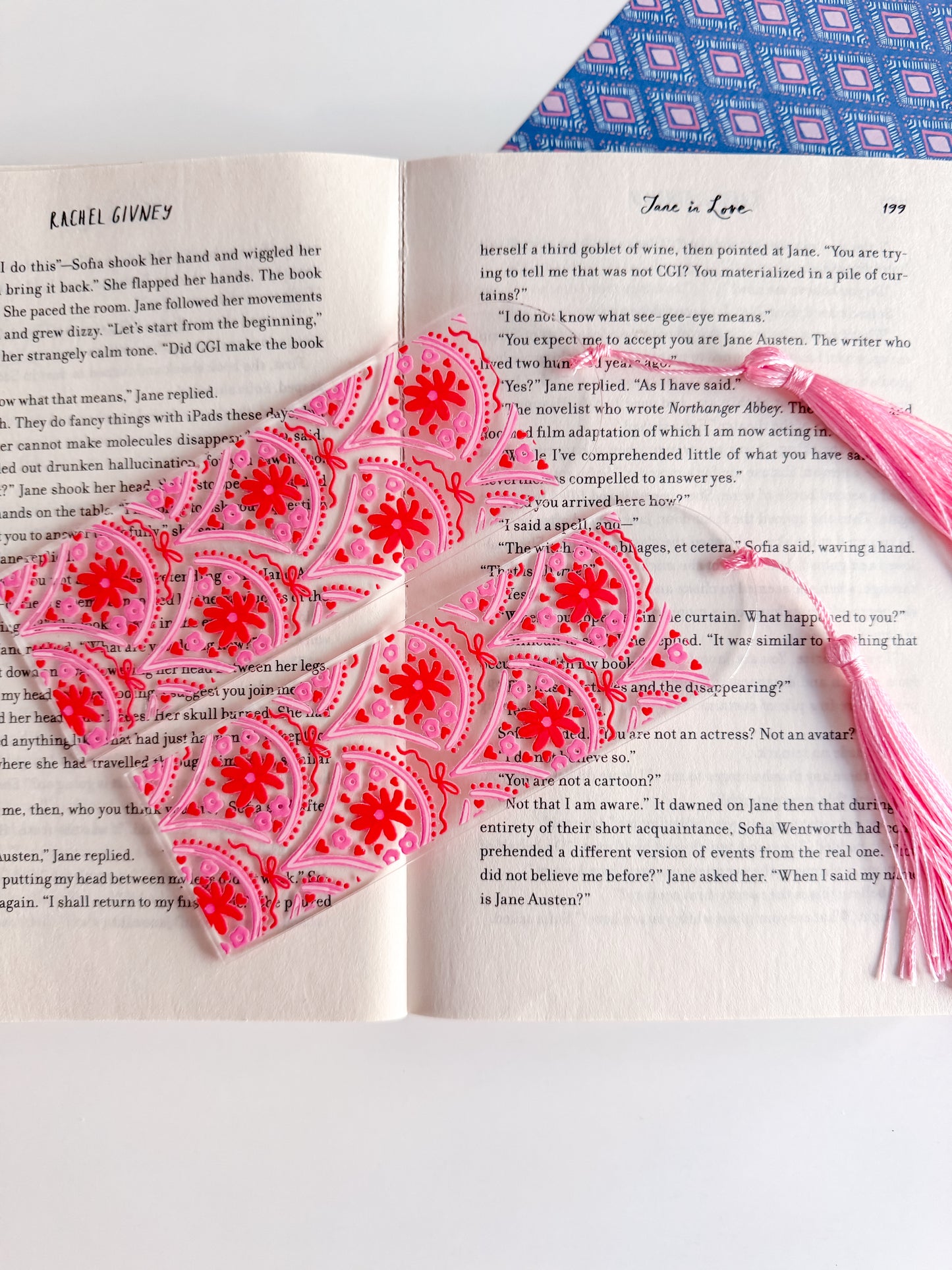 Heart-shaped pink and white decorative item on an open book
