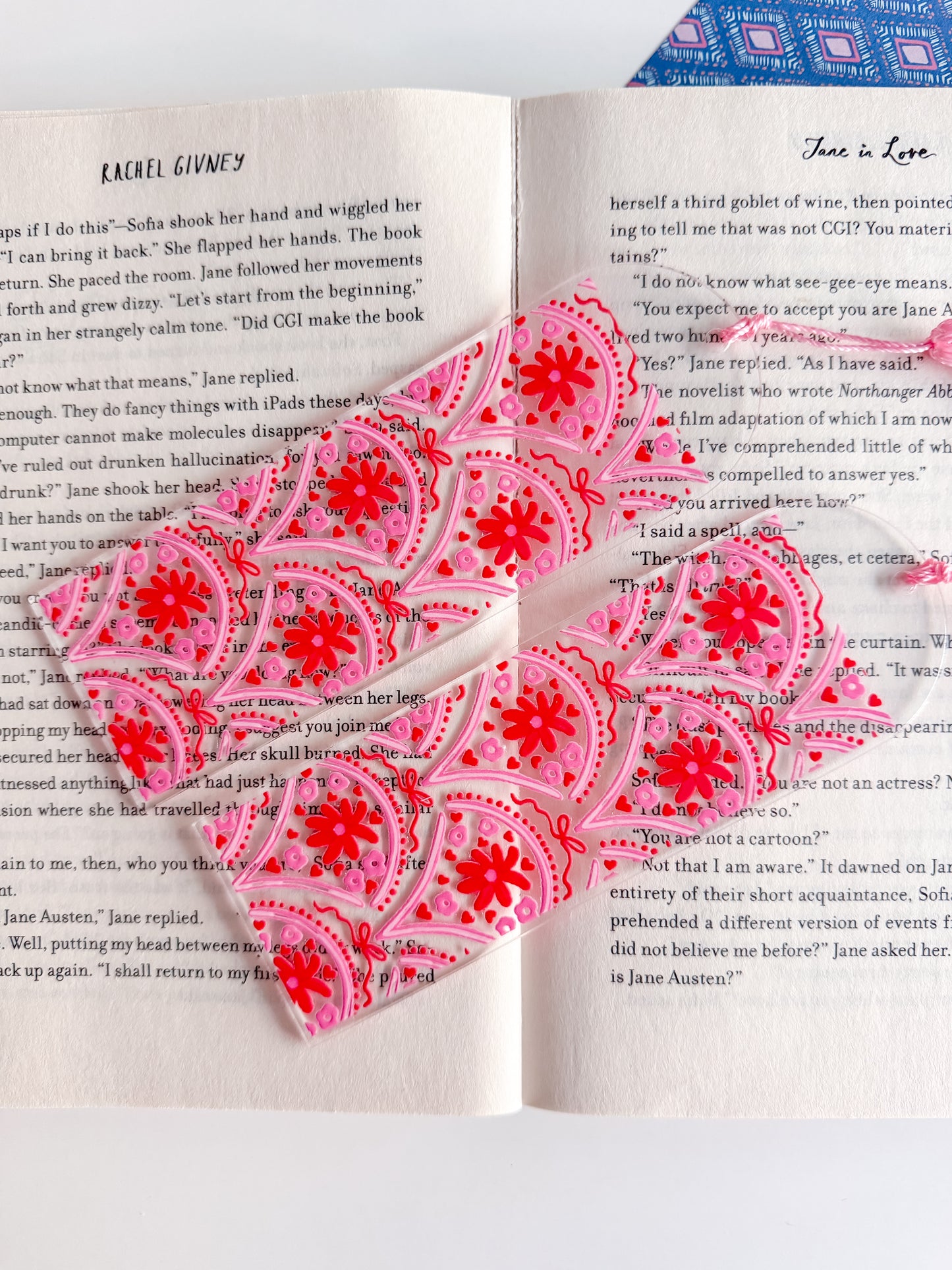 Pink and red patterned paper on an open book