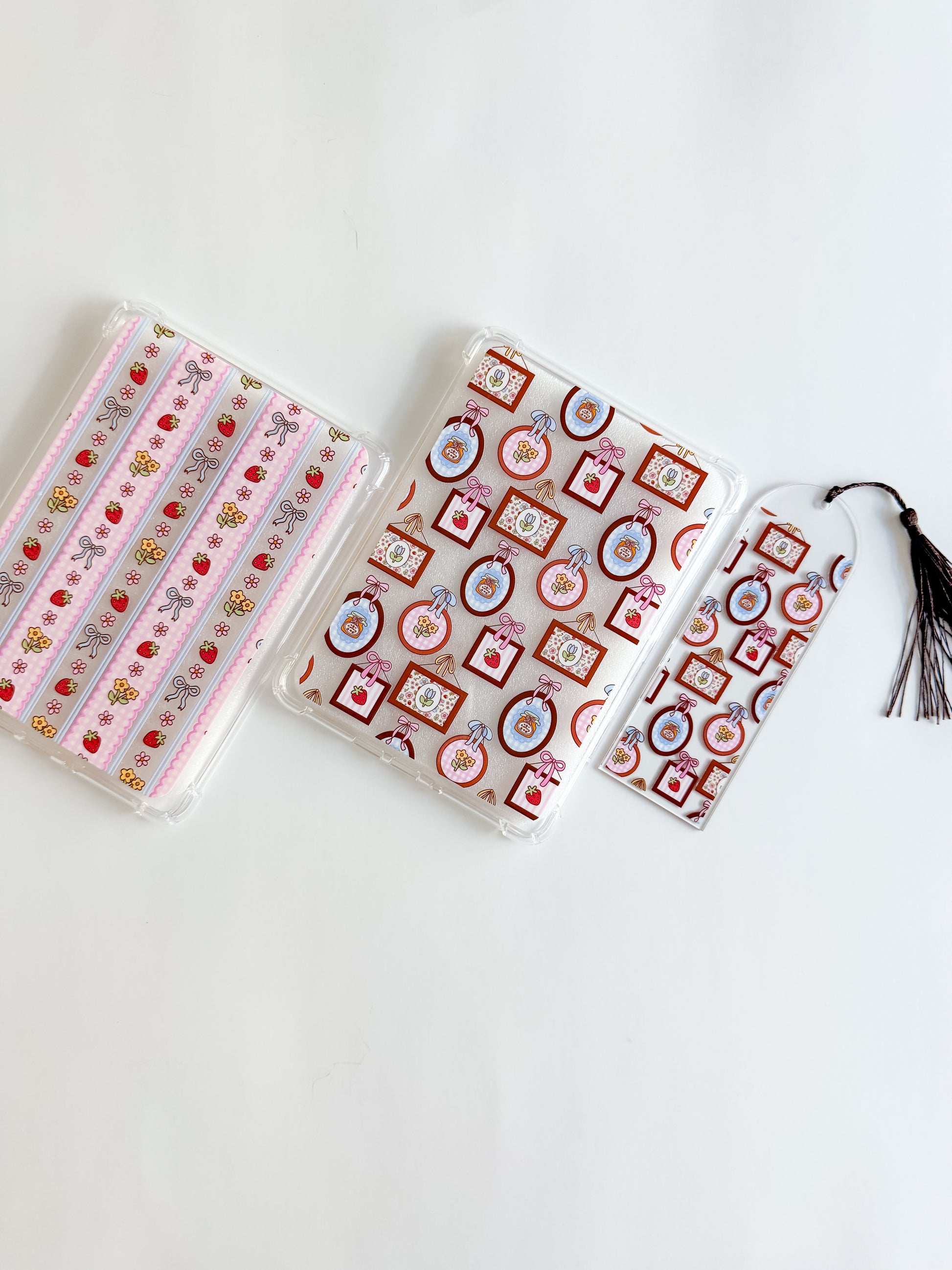 Two spring patterned kindle cases and one with a matching bookmark